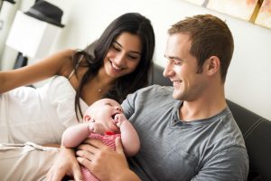 happy couple adopting baby