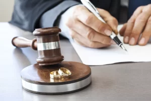 Judge signing a dissolution of marriage document